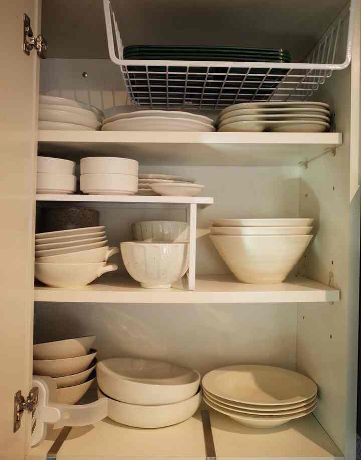 Kitchen organization made easy! 🍽️✨ I love these organizers—they create more space for dishes and keep everything tidy. Also, this $9.99 Target bowl is a fave! Its organic shape is perfect for holding all kinds of food. 😍 #KitchenOrganization #SmallSpaceLiving #TargetFinds