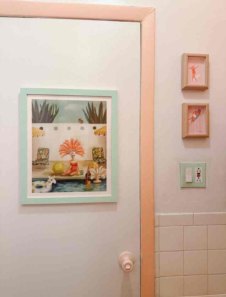 I love to paint, trim, door, knobs, and light switch plates. It’s like the landlord special but better! The two framed prints were cut out leftovers from my wallpaper. #bathroom #paint #color #colorful #artwall 