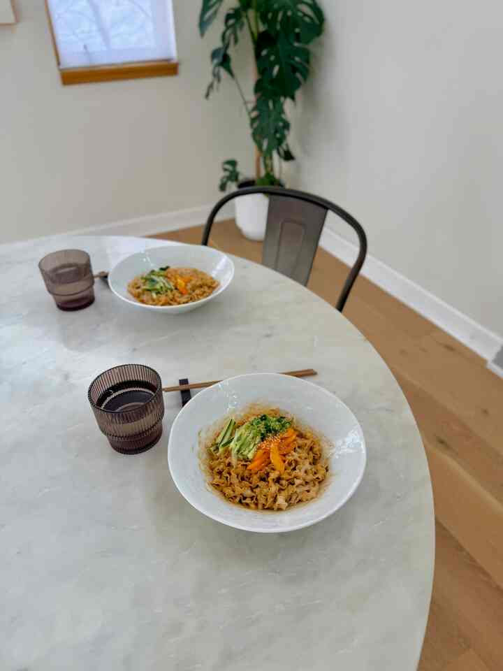 Simple noodle lunch! I love my new Mercer pasta dish from Crate and Barrel. They are so shiny and perfect size for any noodles or salad! #pastabowl #brunch #marble #marbletable #diningtable #diningroom 