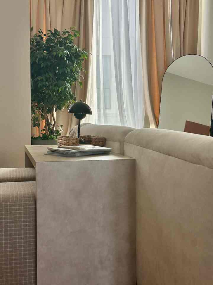 Feeling so serence and appreciative of this little life while walking into my warm living room! Still obsessed with this curtain layout :) #cozy #neutral #beige #mcm #livingroomdecor #japandi #warm #wood #texture #midcentury