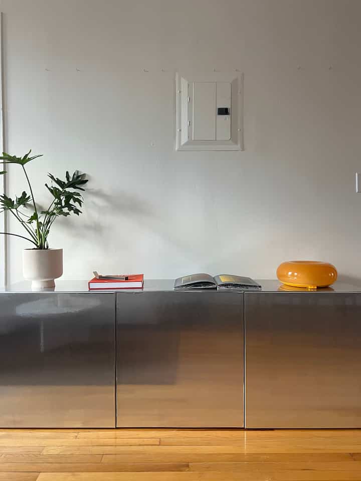 Storage inspo for small spaces! This is my favorite hack for ikea besta units - i used chrome contact paper #livingroominspo #chrometrend #minimal