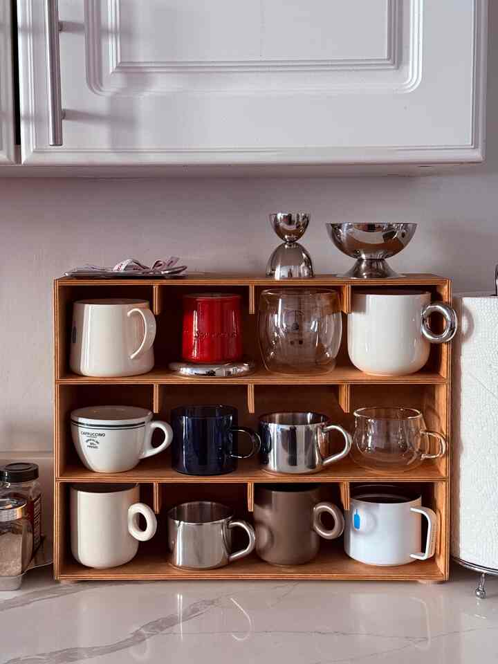 Easy DIY for the popular mug shelf using the Ikea Motte Drawers! I took out all the drawers, cut the back of the board to make it less deep and used the spare wood to make the little notches. Simple wood glue and a nice coat of wood stain to DIY the popular mug shelf! #diy #ikea #ikeahack #mug #mugshelf #kitcheninterior #coffee #diningroom #berry #bowl #breakfast #brunch 