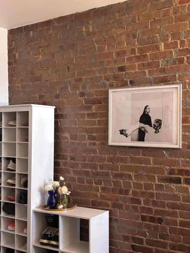 My favorite wall art, located by the entrance.  It’s of our favorite designer, Rick Owens. 


#walldecoration #shelf #entranceinterior #exposedbrick 