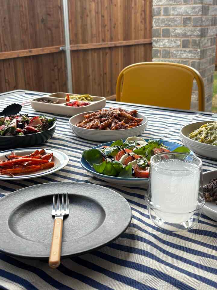 Enjoying the #patio while I can! 
Being out in the sun makes me happy. With my favorite glass full of lemonade and plates that I cherish 🥰
Still on the search for the perfect patio table cloth!