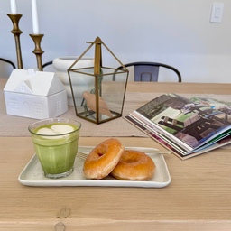 Sipping my matcha latte and indulging in some delectable donuts while engrossed in my favorite interior design book provides me with a steady source of motivation throughout the day. 
#dining #wood #diningtable #matcha #book #calm #selfcare 
