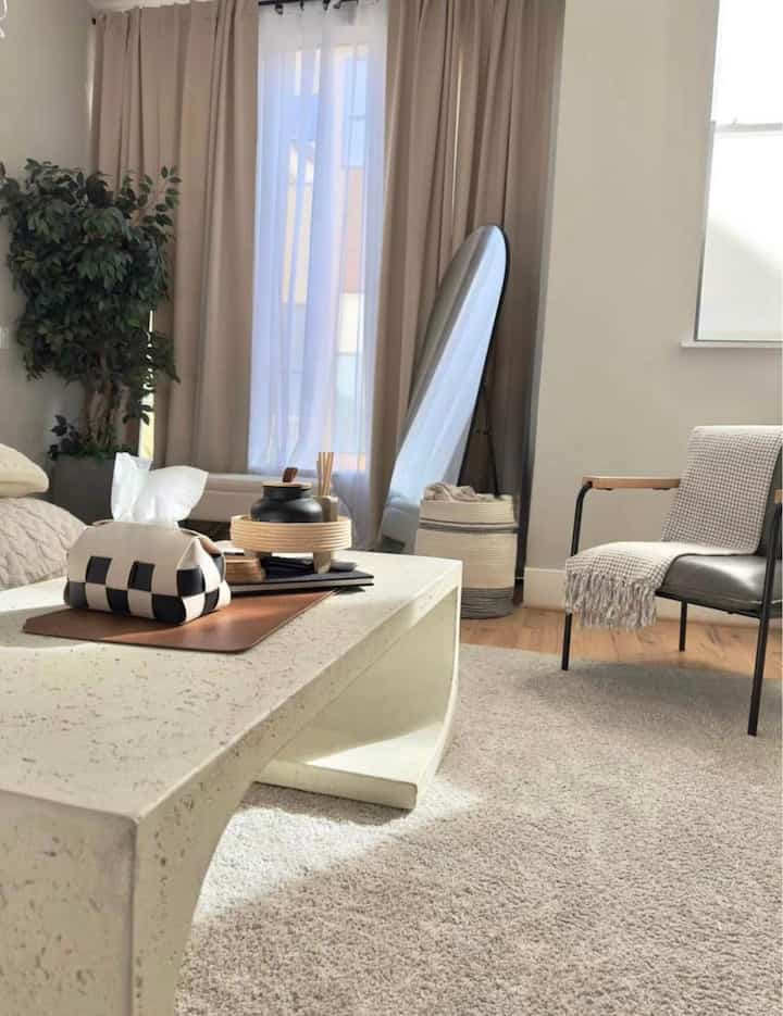 Warm neutrals and organic textures 🌿☀️ A sculptural coffee table, cozy textiles, and soft natural light make this space feel effortlessly inviting. ✨🖤 #ModernSerenity #CozyLiving #MinimalistAesthetic