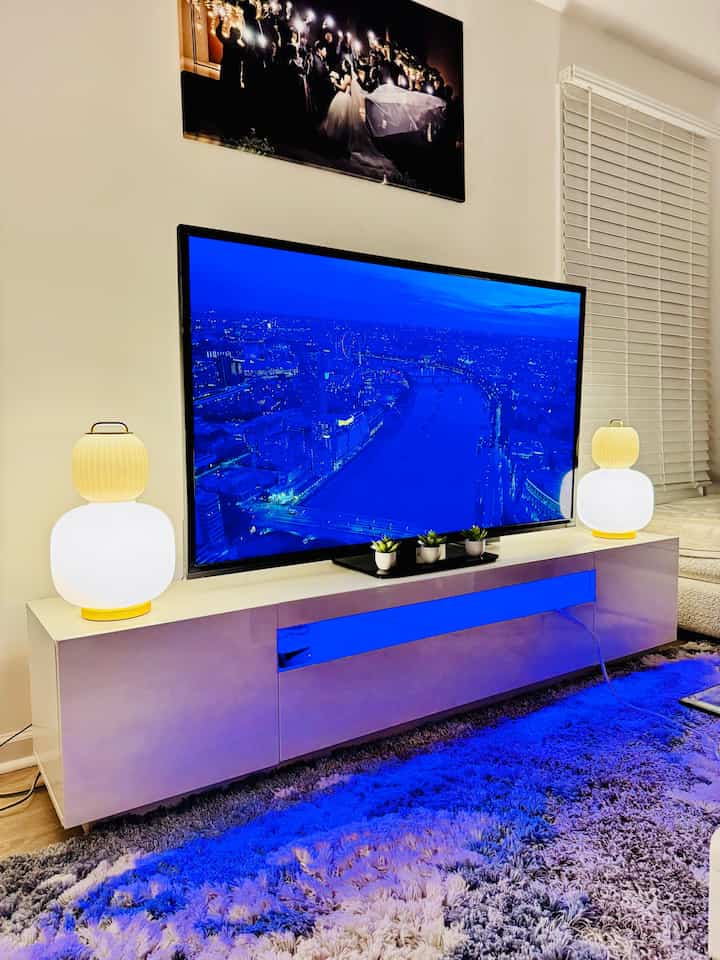 I’m obsessed with my TV stand! The high-gloss white finish gives my space such a sleek look, and the built-in lights add the perfect vibe for movie nights. Plus, the storage is a game-changer! 

 #tvstand #tvcabinet #livingroominterior #livingroom #livingroomdecoration #cozy #cozylivingroom #cozyhome #homedecor #moderninterior #modernhouse #modernstyle #storagespace #storagecabinetinterior 