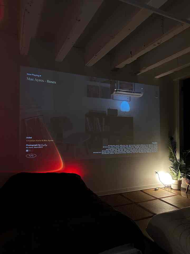 winding down for the night in my japandi home 🫶 #japandi #minimal #studio #smallroominterior #studiointerior #projector #minimalinterior 