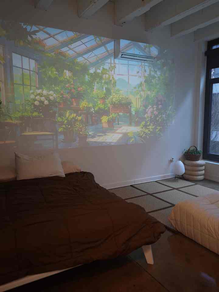 White and dark brown toned bedroom with tatami mat and projector, creating a warm modern atmosphere