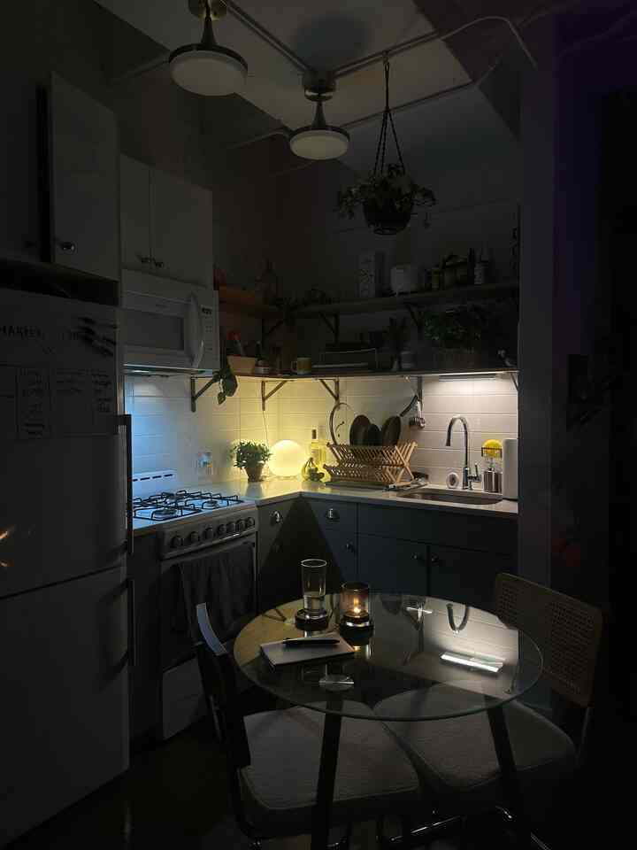 cozy kitchen aesthetics - setting the space is perfect for a journal + tea windown routine !!! #kitcheninterior #night #nightroutine #kitchendesign #Kitchenwithoutuppercabinets 
