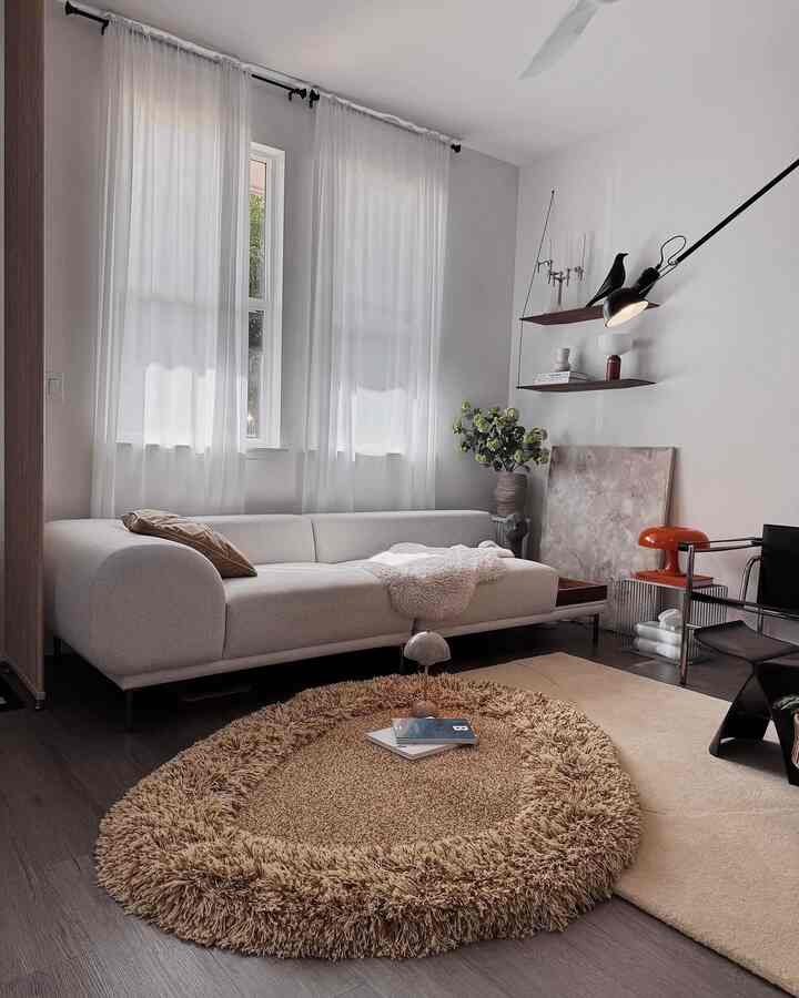 #livingroominterior #livingroom #livingroomdecoration #rug #lamp #lighting #magazine #cushion #sofa #couch #loungechair #stool #canvasframe #shelf #shelfdecor #candleholder #minimal #midcentury #midcenturymodern #neutral