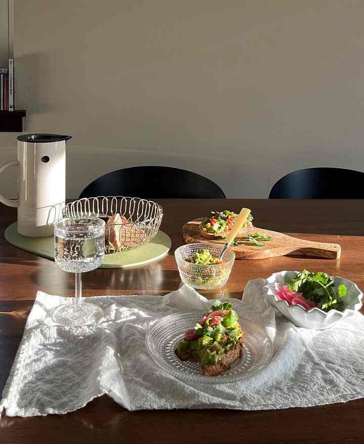 Warm brown-toned dining room featuring white teapot and cutlery set in a modern home cafe atmosphere