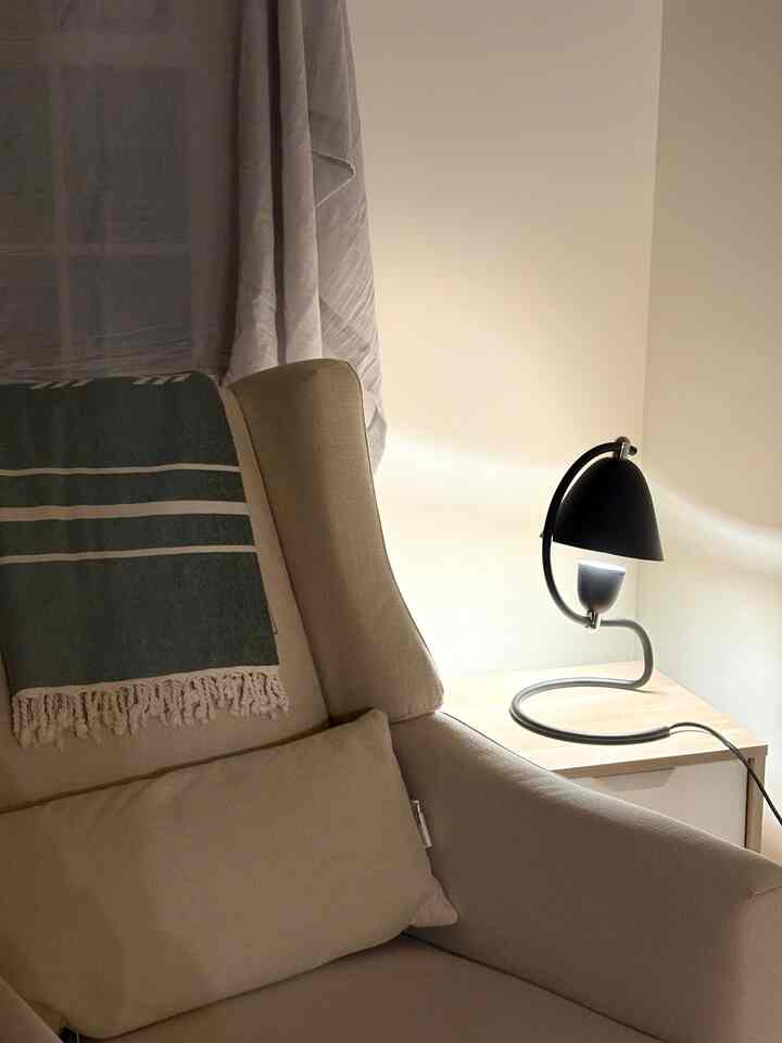 When your curtain rod still hasn’t arrived, so you’re stuck hanging random fabric over the window for the nursery. 🫠 
#nursery #bedroom #tablelamp #lamp #nurseryinterior #ikea