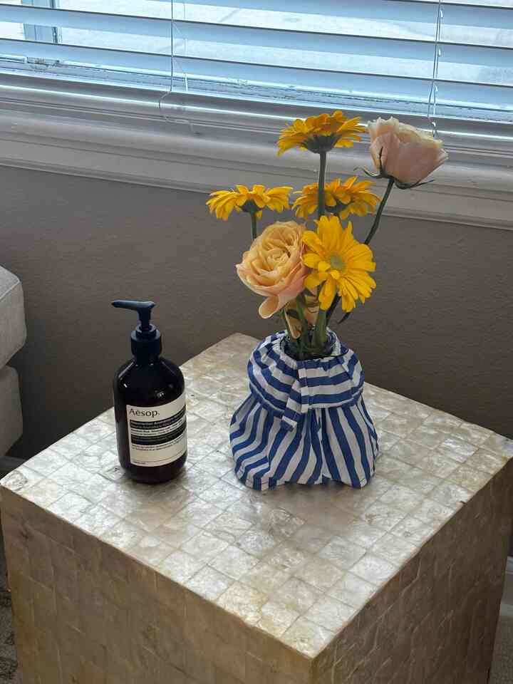 Visited a florist friend’s house to help out with her wedding flower decoration project. The little handmade stripe skirt for the vase was definitely my favorite thing in the space #handmade #flowers