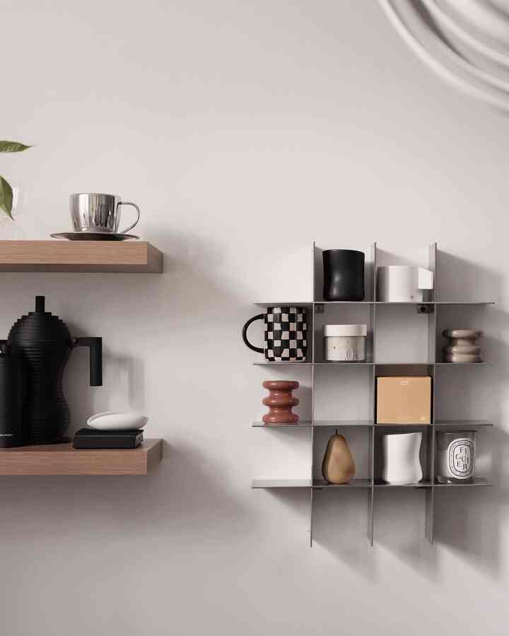 Natural and minimal home cafe space with white walls and wood-tone shelves in harmonious arrangement