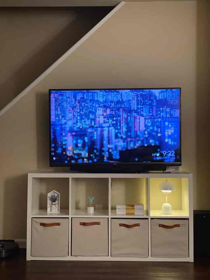 The TV glows with shades of blue the child adores, and the lamp has found its rightful place to shine 💛💙

#livingroom #lamp #smallhouseinterior #minimal 