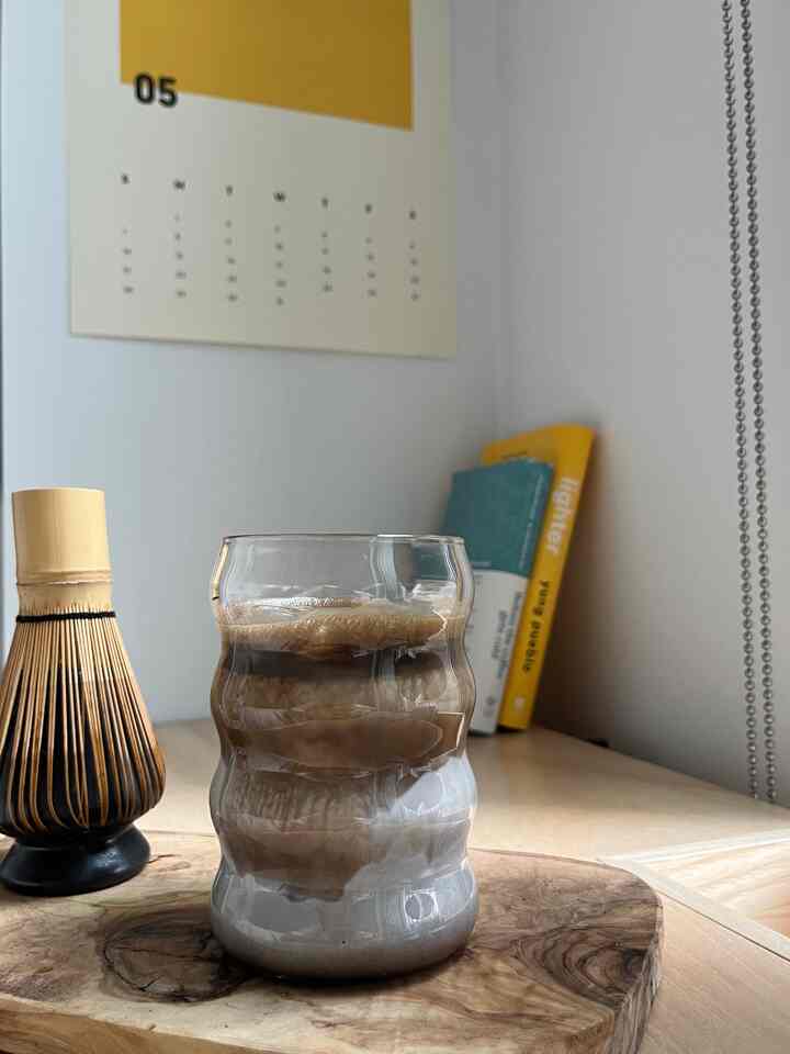 Natural toned kitchen space featuring a ripple glass and olivewood serving bowl creating a cozy home cafe atmosphere