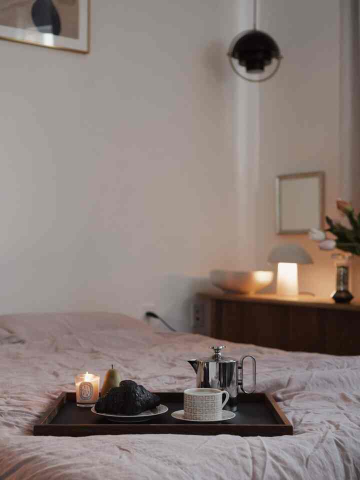 Wrapped in the calm of the night.

#bedroom #bedroominterior #night #bedroomdecor #lamp #lighting #lightinginterior #moodlight #tray #teapot #coffeecup #plate #candle #bedding #dog #vintagemirror
