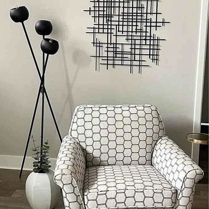 A modern mix of textures and shapes, highlighted by this unique floor lamp. #floorlamp #modernstyle