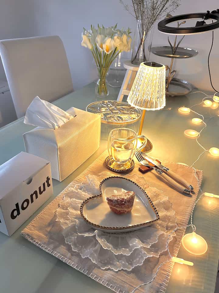 My favorite dining spot and corner. I place all my favorite decor on one side and nibble on anything pleasantly savory or sweet. 😋

I’m obsessed with I’m donut ?, a Japanese donut brand that opened in Times Square, lately. It has an amazing airy texture. 

#itsmyhouseandilivehere #plating #frenchmodern #romantic 