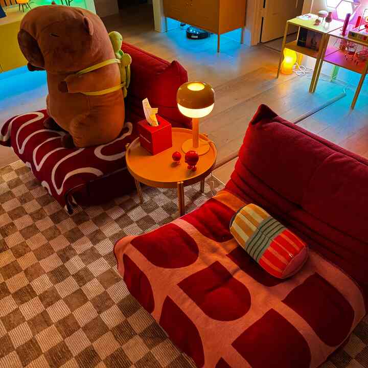The Togo sofas in the living room are both fun and functional.  Adding a playful pop of color and tying the room together!
#maximalist #HappyHouse 
