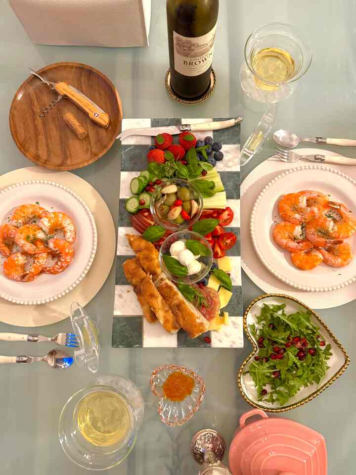 White and wood-toned dining room featuring heart-shaped dishes and cozy tableware with a romantic home party atmosphere