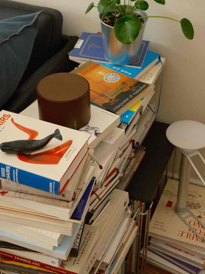 Books have found their way onto the floor.

#bookstorage #wirecube #cookbooks #portablelamp #tablelamp #paperweight #naturalinterior 