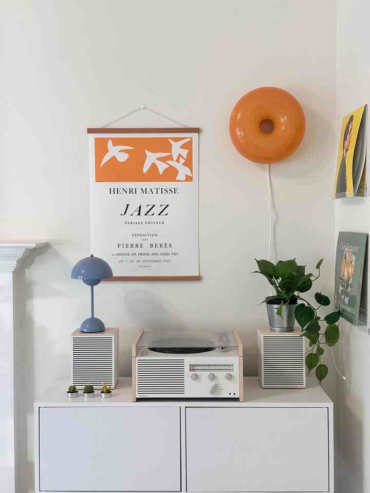 Cozy vibes with music, art, and a touch of greenery 🌿✨


 #HomeVibes #MinimalLiving #summerparty #summerhosting #dinnerpartydecor #summerdinnerparty #tablestyling #homebar #turntable #lamp #ikea #ikealamp #simpleinterior #poster #colorinterior 