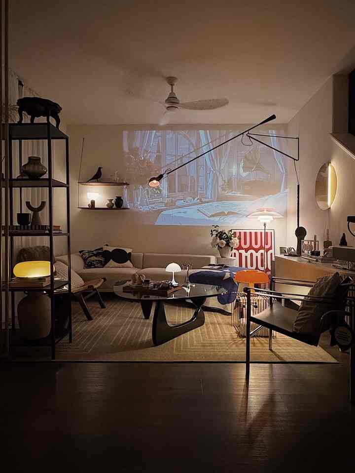 The living room on a late summer night 🌛

#livingroom #livingroominterior #livingroomdecoration #posterframe #lamp #lighting #lightinginterior #moodligjt #loungechair #coffeetable #cushion #sofa #shelf #projector 