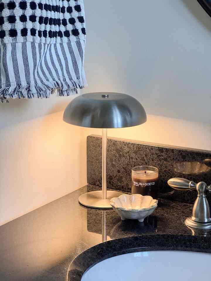 Light’s on, stress is gone💡
.
.
.
#fallswitch #summertofall #seasonaldesign #cozycorner #lamp #warmlight #powderroom #powderroominterior #bathroom #moody #minimalwithmood #frenchgirlhome