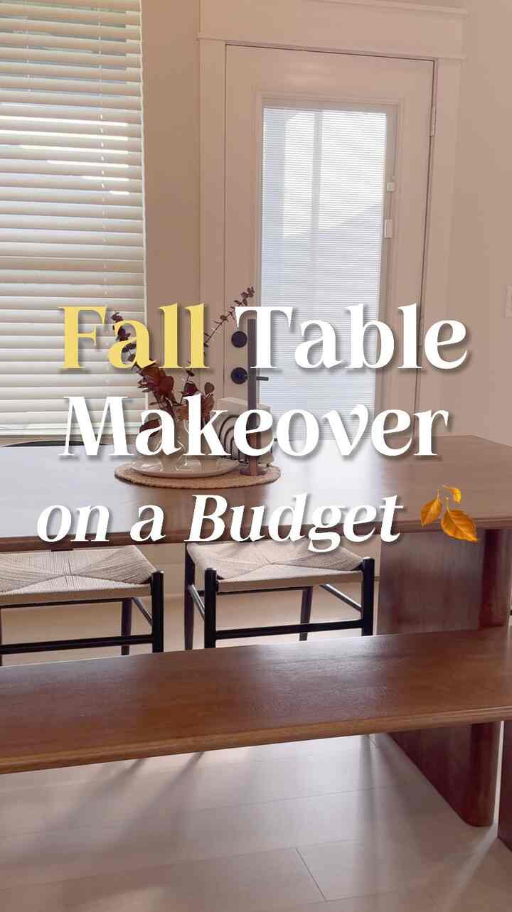 Beige and natural wood-toned dining room featuring a wooden dining table with bench and chairs, creating a cozy and simple fall atmosphere