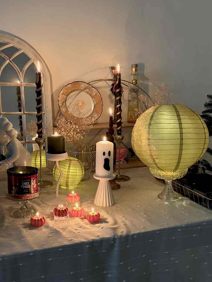 Halloween vibes on my coffee table brought to you by my collection of dopamine decor candles and paper lanterns. 🧡🖤

A decor tip is to limit your color selection of large candles and lanterns to 3 main color shades. For me, it’s white, black (dark green counts here), and gold. 

Another tip is if you’re going with gold as an accent, try to select warm whites and beige colors for your white items instead of a cool white - it’ll make your space look cozier and come together better. ✨

#halloweendecor #halloweenvibes #fallfun #romantic 