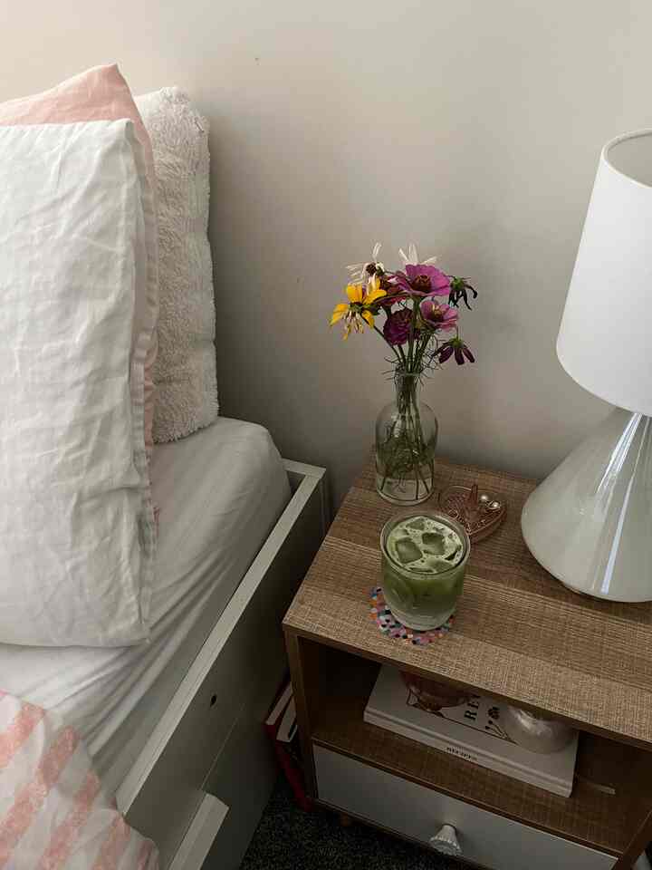 love keeping flowers on my nightstand! i love waking up in the morning and seeing flowers right away #bedroominterior #bedroom #nightstand #nightstandtable #bedside #bedsidetable 