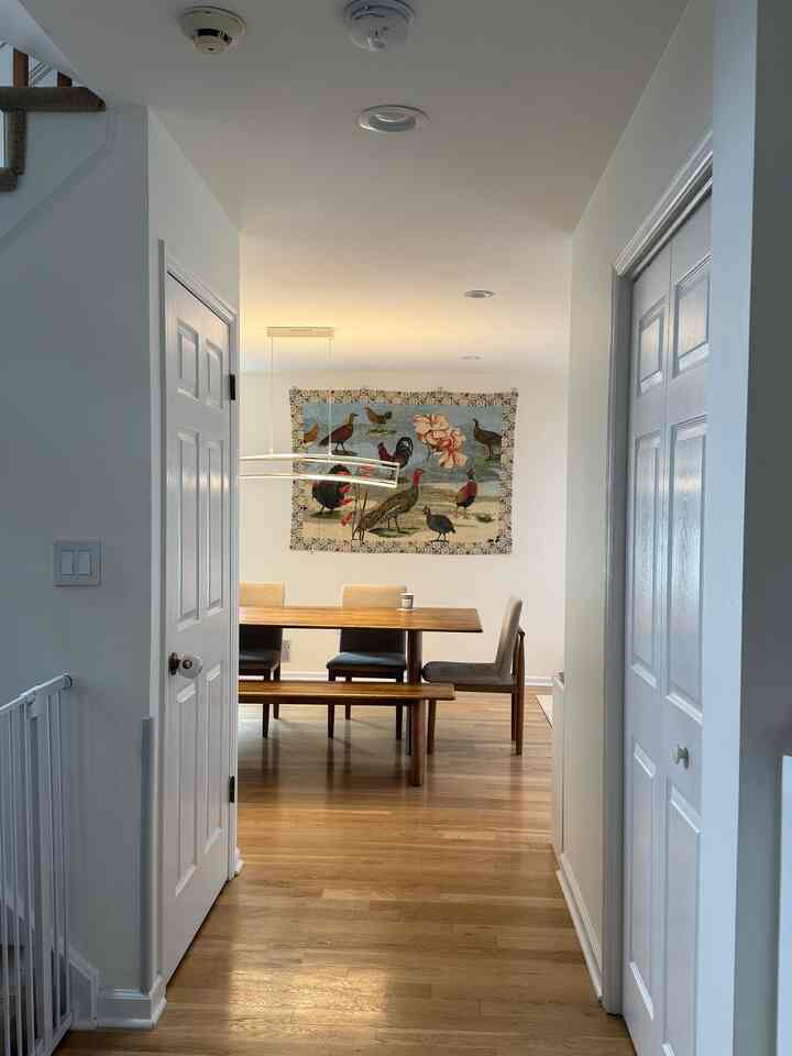 The first thing you see when you walk through our door—and one of my favorite views in our home. It feels cozy every single time!

#diningroom #diningtable #diningchair #throw