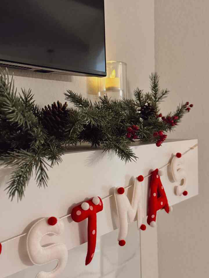 A simple garland and a few glowing candles were all it took to bring Christmas magic into our home. Feeling warm and grateful tonight ✨🕯️

#christmasdecor #christmasgarland #holidaydecor #christmasvibes #festivehome #cozyhome #manteldecor #homedecorideas #holidayaesthetic #christmasathome #cozychristmas #holidaymagic #christmasmood #tistheseason