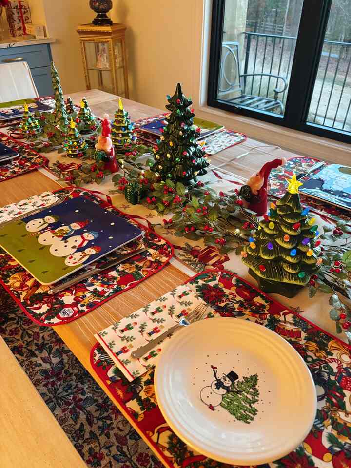 Natural-toned dining room featuring a table set with Christmas trees and Santa decorations creating a cozy atmosphere