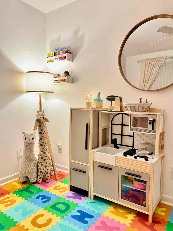 A cozy little corner of my baby’s playroom 🤍
She’s obsessed with her play kitchen and loves pretending to cook just like me. Watching her grow into her own little person melts my heart every single day 🥹

#baby #babyroom #babyroomdecor #playroom #nursery #nurseryinterior #nurserydecor #cozy #cozyroom #cozyhome #interior #homedecor 