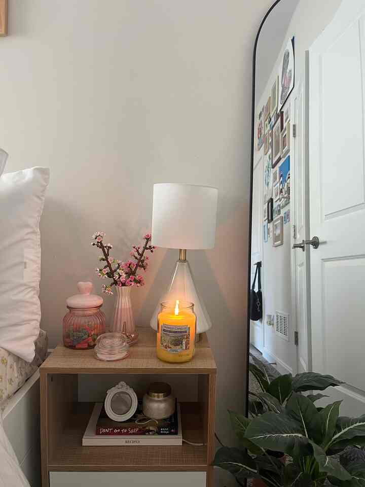 lighting a candle instantly makes my space fesl cozy and cleaner #bedroom #candle #bedroomdecor #decor #nightstand #nightstanddecor 