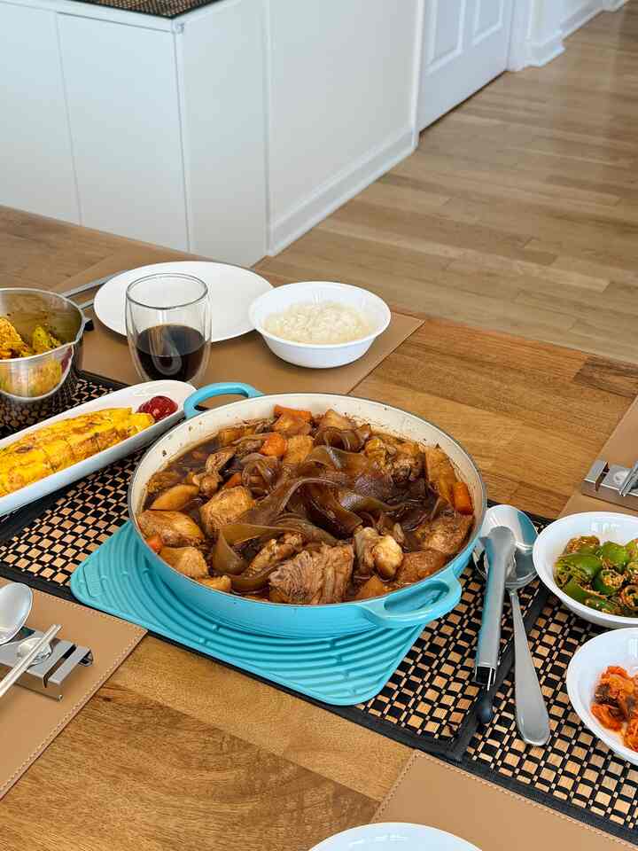 Natural-toned dining table featuring assorted dishes and tableware conveying a cozy home lunch setting