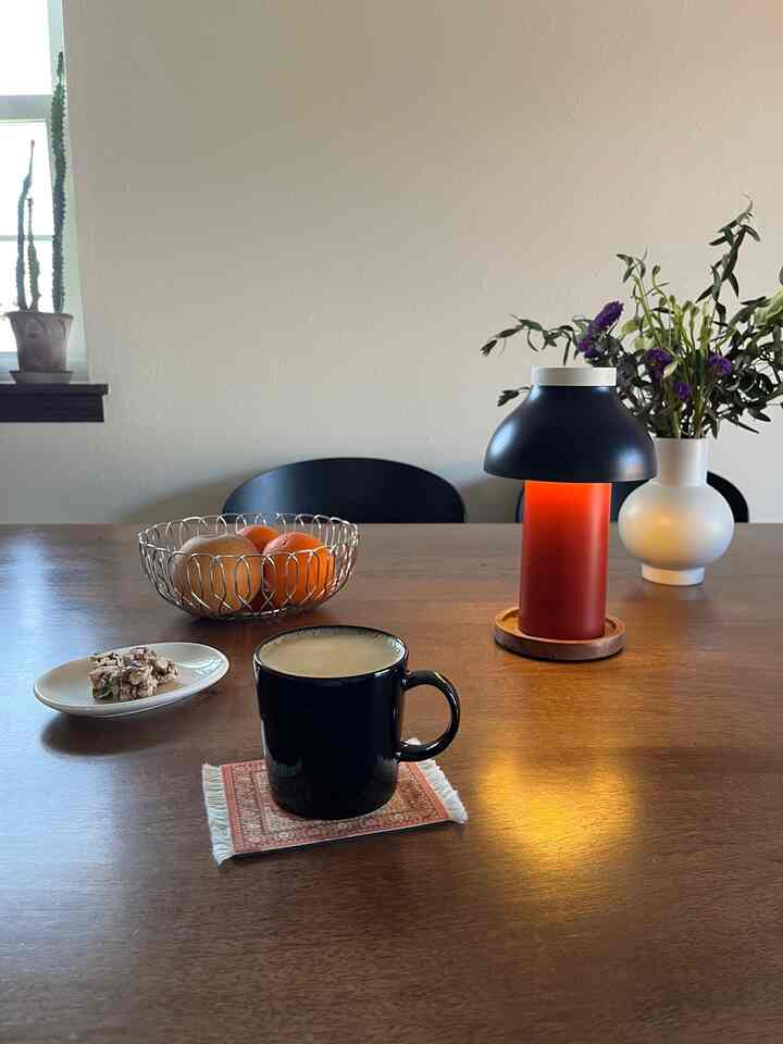 I can’t start my morning without a cup of coffee.

#diningtable #mug #lamp 
