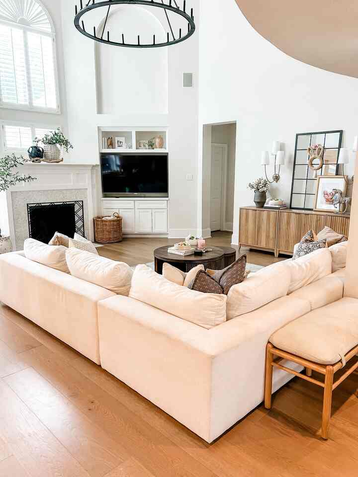 Full view of our living room. #openconcept #wagonwheellight #whitesectional #easterdecor 