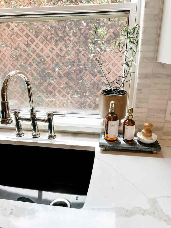 Did you know trader joe’s sells tiny olive trees?? #kitchensink #kitchenstyling #soapdispenser #blancosink 