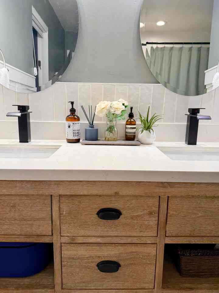 Natural-tone bathroom featuring wooden vanity and spa blue shower curtain, creating a modern and serene space