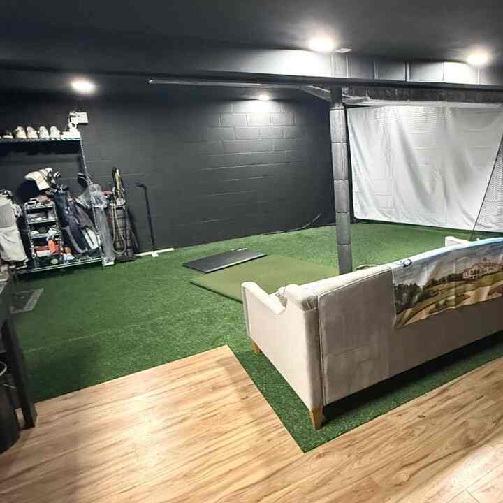 Black paint covers the entire gameroom, from the walls to the ceiling. 
#gameroom #black #color #golf #basement