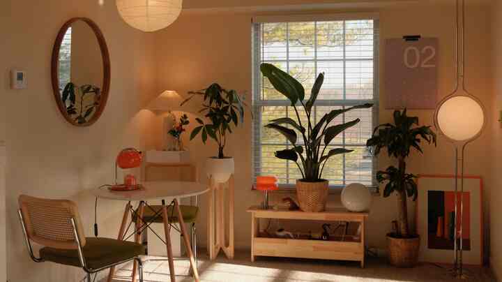 🏠 Inside a cozy 928 sq ft haven bathed in orange hues and warm glow