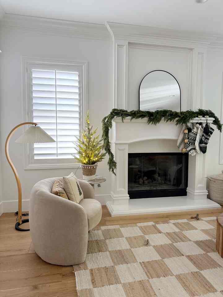 Cheistmas decor in living room. Cozy, neutral, festive. #christmasdecor #christmasstyling #neutrallivingroom #christmasstockings