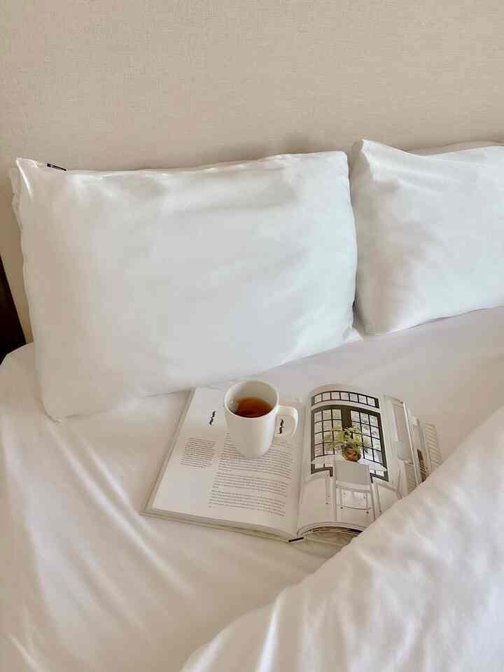Tea and reading in bed #pillows #pillowcase #coffeetablebook 