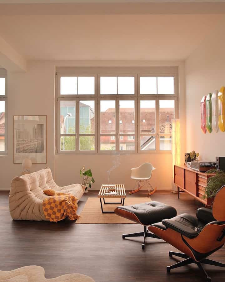 A cozy living room with natural ivory and brown tones featuring mid-century modern furniture and a comfortable bean bag sofa