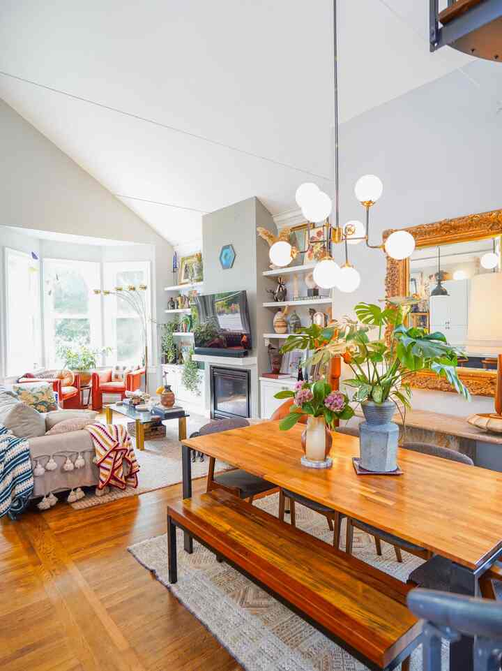My eclectic and transitional dining room/living room! A lot of love went into these spaces #woodendiningtable #ceilingpendant #baywindow