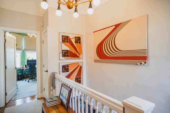 I love having bold funky prints in my hallways #redaccents #hallwaydecor #walldecor